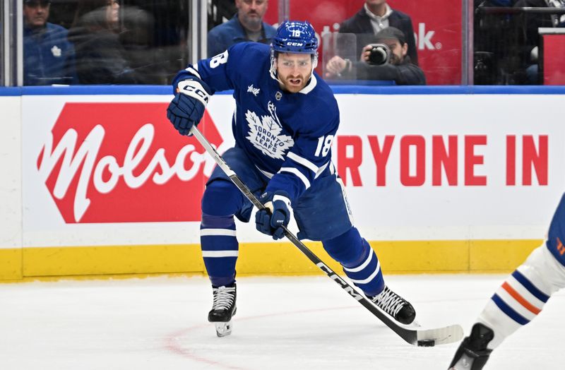 Mar 23, 2024; Toronto, Ontario, CAN; Toronto Maple Leafs forward Noah Gregor (18) shoots the puck against the Edmonton Oilers in the first period at Scotiabank Arena. Mandatory Credit: Dan Hamilton-USA TODAY Sports