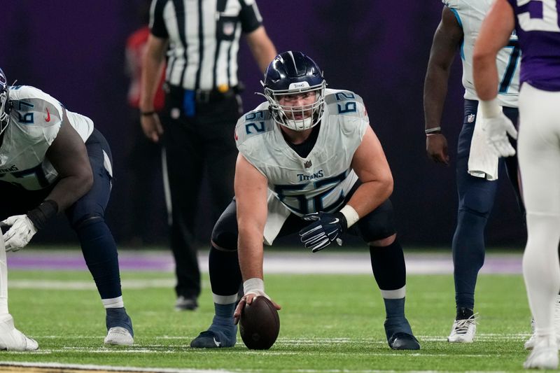 Tennessee Titans center Corey Levin (62) gets set for a play during the second half of an NFL football game against the Minnesota Vikings, Saturday, Aug. 19, 2023, in Minneapolis. (AP Photo/Charlie Neibergall)