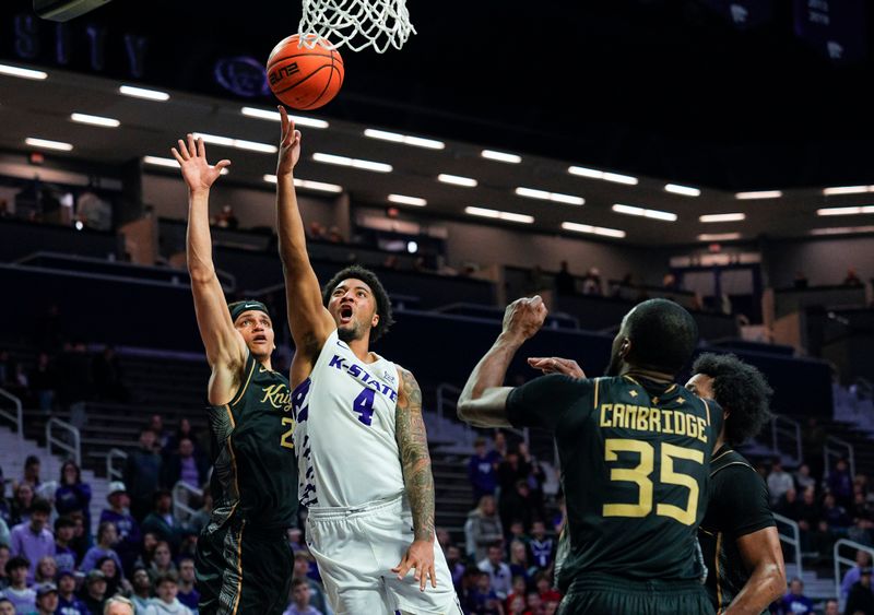Jan 14, 2026; Manhattan, Kansas, USA; Kansas State Wildcats guard PJ Haggerty (4) shoots against against the UCF Knights during the second half at Bramlage Coliseum. Mandatory Credit: Jay Biggerstaff-Imagn Images