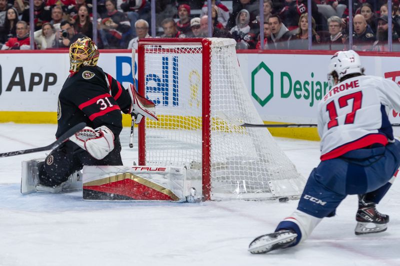 Jan 30, 2025; Ottawa, Ontario, CAN; Washington Capitals center Dylan Strome (17) fans on a shot intended towards Ottawa Senators goalie Anton Forsberg (31) in the second period at the Canadian Tire Centre. Mandatory Credit: Marc DesRosiers-Imagn Images