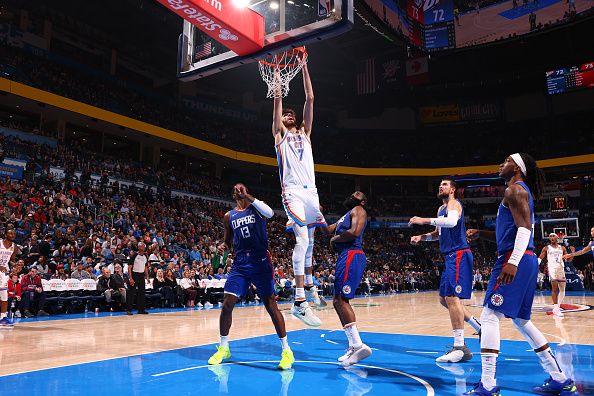 OKLAHOMA CITY, OK - DECEMBER 21: Chet Holmgren #7 of the Oklahoma City Thunder dunks the ball during the game against the LA Clippers on December 21, 2023 at Paycom Arena in Oklahoma City, Oklahoma. NOTE TO USER: User expressly acknowledges and agrees that, by downloading and or using this photograph, User is consenting to the terms and conditions of the Getty Images License Agreement. Mandatory Copyright Notice: Copyright 2023 NBAE (Photo by Zach Beeker/NBAE via Getty Images)