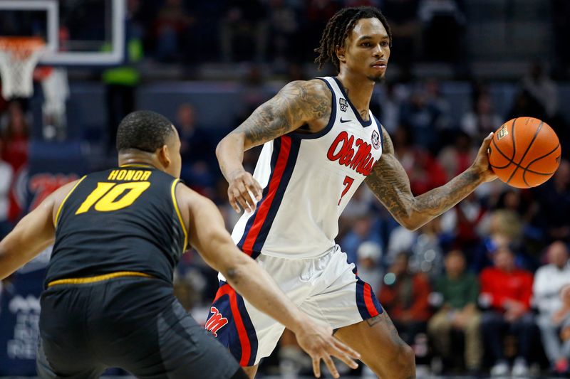 Feb 17, 2024; Oxford, Mississippi, USA; Mississippi Rebels guard Allen Flanigan (7) passes the ball as Missouri Tigers guard Nick Honor (10) defends during the second half at The Sandy and John Black Pavilion at Ole Miss. Mandatory Credit: Petre Thomas-USA TODAY Sports