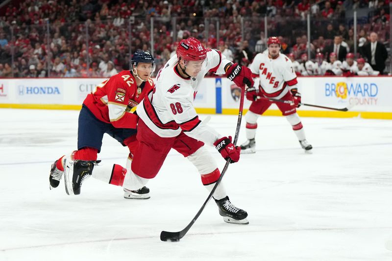 Nov 10, 2023; Sunrise, Florida, USA; Carolina Hurricanes center Martin Necas (88) shoots the puck against the Florida Panthers during the first period at Amerant Bank Arena. Mandatory Credit: Jasen Vinlove-USA TODAY Sports