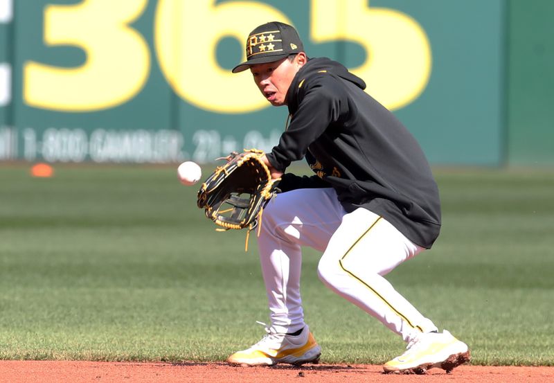 Apr 7, 2025; Pittsburgh, Pennsylvania, USA;  Pittsburgh Pirates infielder Tsung-Che Cheng (71) warms up before the game against the St. Louis Cardinals at PNC Park. Mandatory Credit: Charles LeClaire-Imagn Images