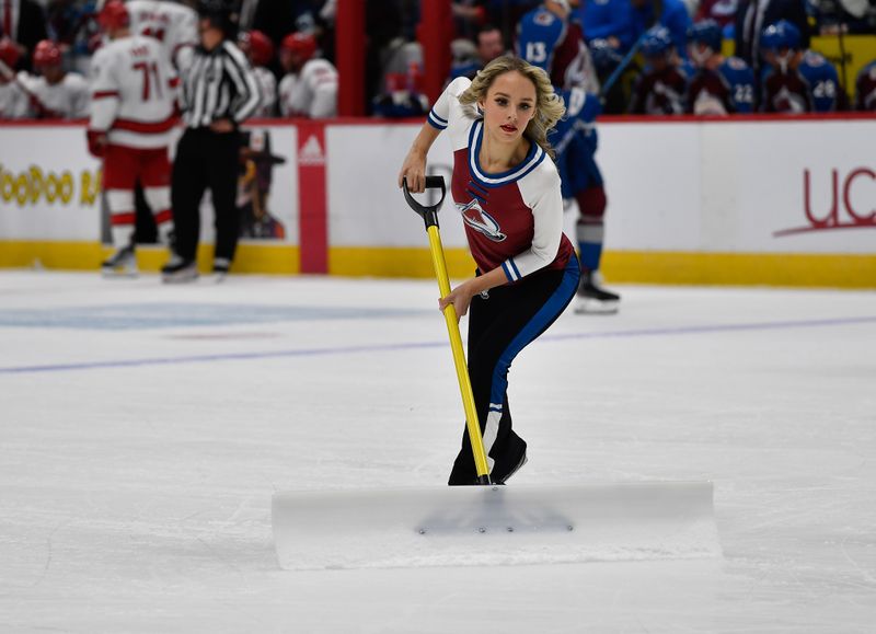 Oct 21, 2023; Denver, Colorado, USA; Colorado Avalanche Ice Patrol clear the ice during a break in the action during the Colorado Avalanche and Carolina Hurricanes game at Ball Arena. Mandatory Credit: John Leyba-USA TODAY Sports