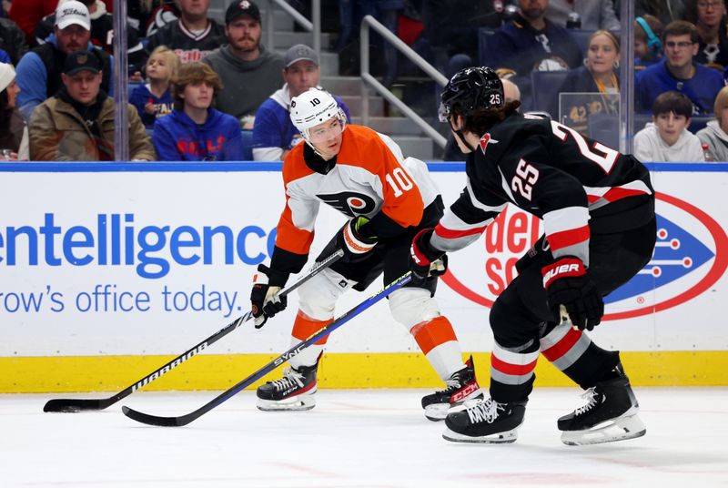 Nov 3, 2023; Buffalo, New York, USA;  Philadelphia Flyers right wing Bobby Brink (10) looks to make a pass as Buffalo Sabres defenseman Owen Power (25) defends during the first period at KeyBank Center. Mandatory Credit: Timothy T. Ludwig-USA TODAY Sports