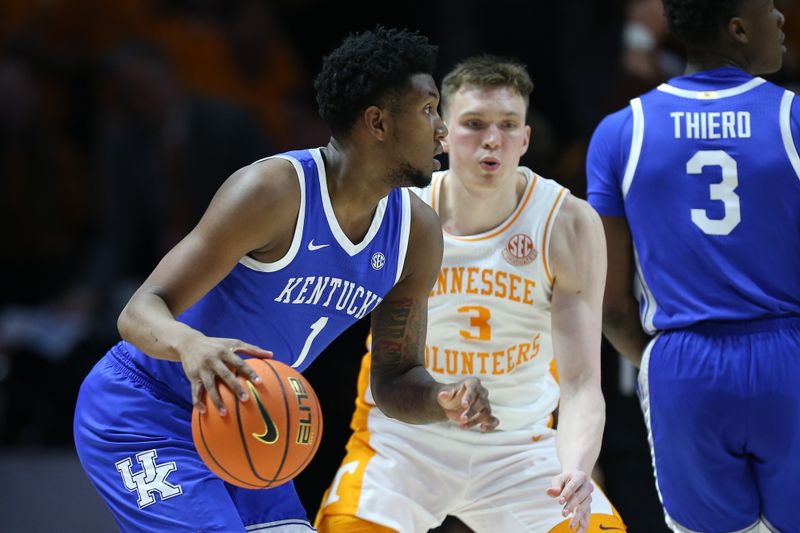 Mar 9, 2024; Knoxville, Tennessee, USA; Kentucky Wildcats guard Justin Edwards (1) moves the ball against Tennessee Volunteers guard Dalton Knecht (3) during the first half at Thompson-Boling Arena at Food City Center. Mandatory Credit: Randy Sartin-USA TODAY Sports