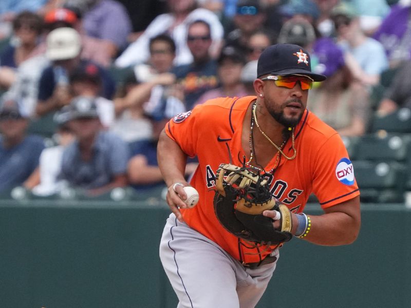 Jul 19, 2023; Denver, Colorado, USA; Houston Astros first baseman Jose Abreu (79) fields the ball in the ninth inning against the Colorado Rockies at Coors Field. Mandatory Credit: Ron Chenoy-USA TODAY Sports