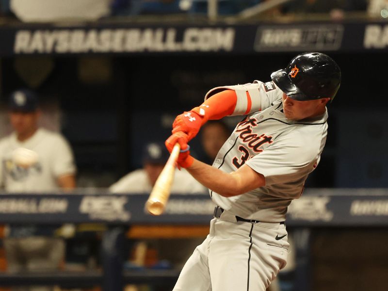 Apr 22, 2024; St. Petersburg, Florida, USA; Detroit Tigers outfielder Riley Greene (31) hits a RBI double during the sixth inning against the Tampa Bay Rays at Tropicana Field. Mandatory Credit: Kim Klement Neitzel-USA TODAY Sports