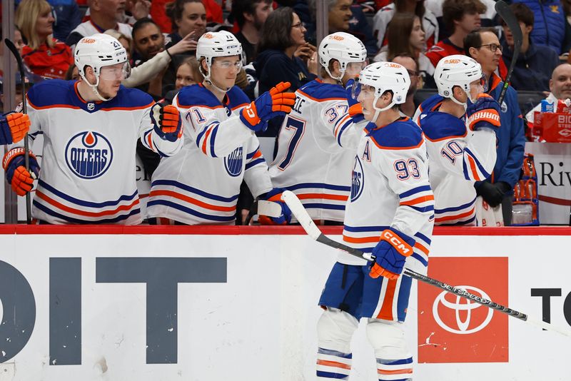 Nov 24, 2023; Washington, District of Columbia, USA; Edmonton Oilers center Ryan Nugent-Hopkins (93) celebrates with teammates after scoring a goal against the Washington Capitals in the first period at Capital One Arena. Mandatory Credit: Geoff Burke-USA TODAY Sports