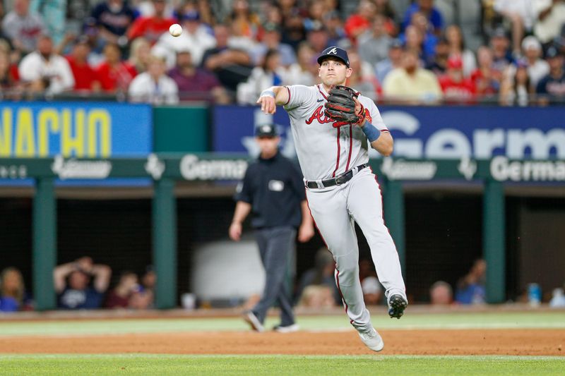 May 15, 2023; Arlington, Texas, USA; Atlanta Braves third baseman Austin Riley (27) throws to first base during the fourth inning against the Texas Rangers at Globe Life Field. Mandatory Credit: Andrew Dieb-USA TODAY Sports