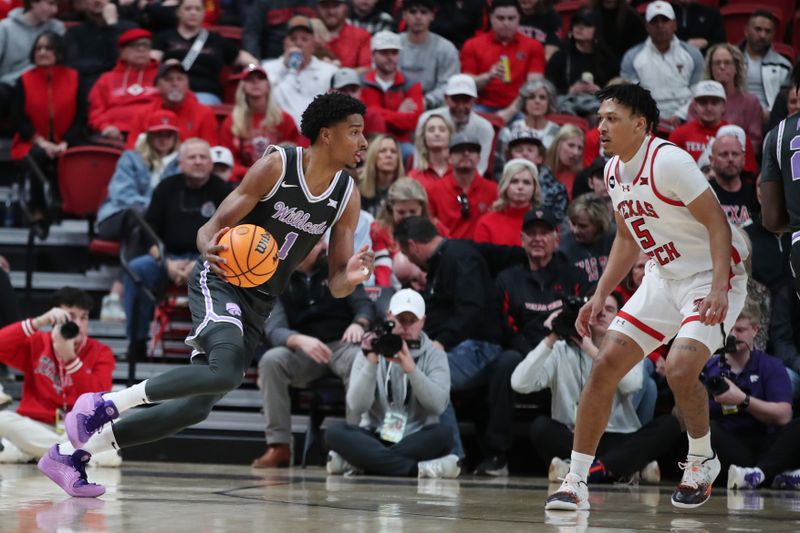 Jan 13, 2024; Lubbock, Texas, USA;  Kansas State Wildcats wing David N   Guessan (1) drives to the basket against Texas Tech Red Raiders guard Darrion Williams (5) in the first half at United Supermarkets Arena. Mandatory Credit: Michael C. Johnson-USA TODAY Sports