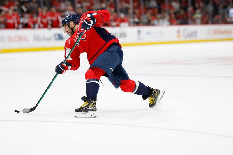 Oct 31, 2024; Washington, District of Columbia, USA; Washington Capitals left wing Alex Ovechkin (8) shoots the puck against the Montreal Canadiens in the third period at Capital One Arena. Mandatory Credit: Geoff Burke-Imagn Images