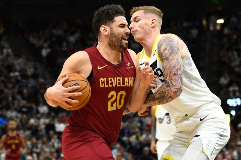 SALT LAKE CITY, UTAH - APRIL 02: Georges Niang #20 of the Cleveland Cavaliers drives against Luka Samanic #19 of the Utah Jazz during the second half of a game at Delta Center on April 02, 2024 in Salt Lake City, Utah. NOTE TO USER: User expressly acknowledges and agrees that, by downloading and or using this photograph, User is consenting to the terms and conditions of the Getty Images License Agreement. (Photo by Alex Goodlett/Getty Images)