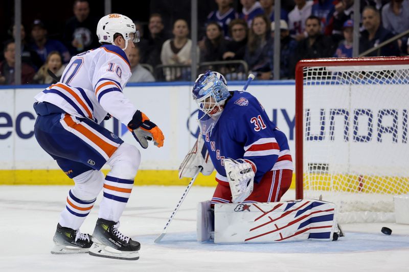 Oct 14, 2025; New York, New York, USA; Edmonton Oilers center Trent Frederic (10) scores a goal against New York Rangers goaltender Igor Shesterkin (31) during the second period at Madison Square Garden. Mandatory Credit: Brad Penner-Imagn Images
