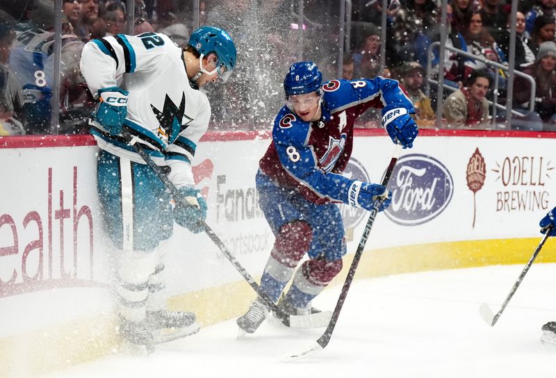 Dec 31, 2023; Denver, Colorado, USA; San Jose Sharks left wing William Eklund (72) and Colorado Avalanche defenseman Cale Makar (8) battle for control of the puck in the third period at Ball Arena. Mandatory Credit: Ron Chenoy-USA TODAY Sports