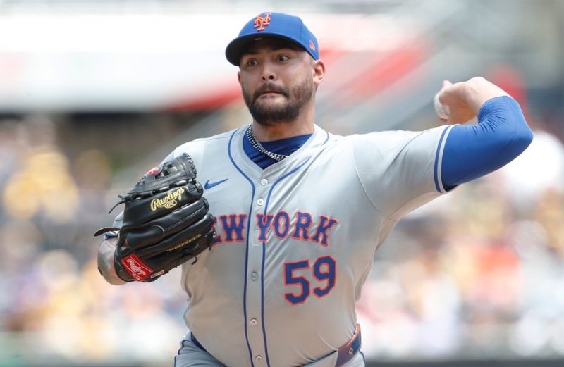 Jul 7, 2024; Pittsburgh, Pennsylvania, USA;  New York Mets starting pitcher Sean Manaea (59) delivers a pitch against the Pittsburgh Pirates during the first inning at PNC Park. Mandatory Credit: Charles LeClaire-USA TODAY Sports