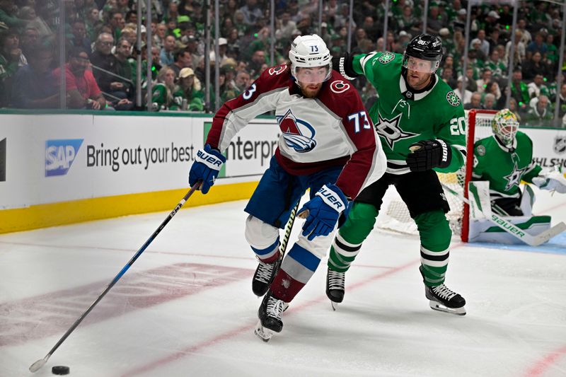 May 7, 2024; Dallas, Texas, USA; Colorado Avalanche center Yakov Trenin (73) controls the puck in front of Dallas Stars defenseman Ryan Suter (20) during the third period in game one of the second round of the 2024 Stanley Cup Playoffs at American Airlines Center. Mandatory Credit: Jerome Miron-USA TODAY Sports