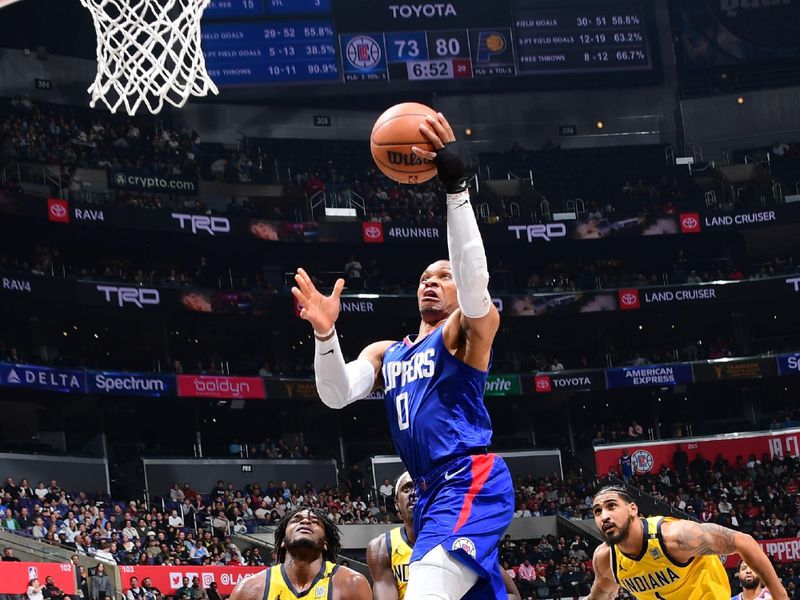 LOS ANGELES, CA - MARCH 25: Russell Westbrook #0 of the LA Clippers drives to the basket during the game against the Indiana Pacers on March 25, 2024 at Crypto.Com Arena in Los Angeles, California. NOTE TO USER: User expressly acknowledges and agrees that, by downloading and/or using this Photograph, user is consenting to the terms and conditions of the Getty Images License Agreement. Mandatory Copyright Notice: Copyright 2024 NBAE (Photo by Adam Pantozzi/NBAE via Getty Images)