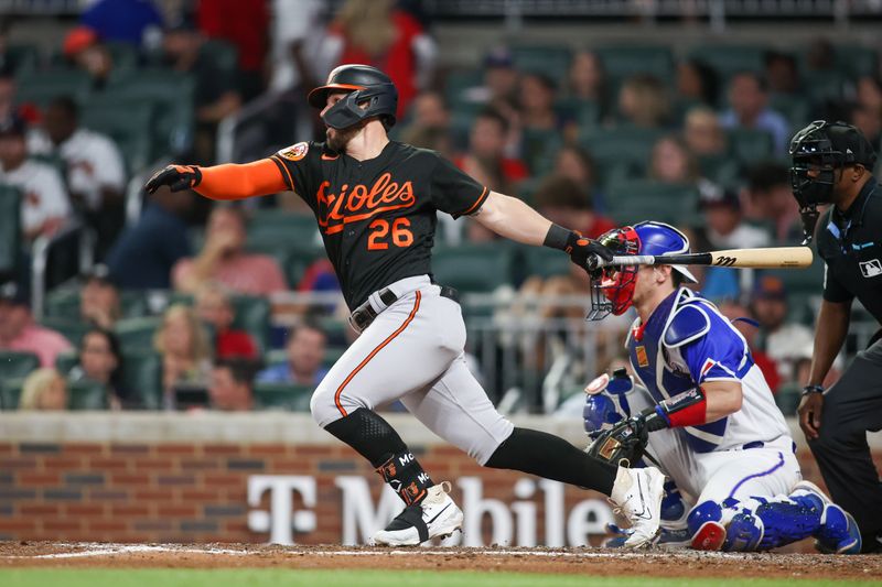 May 6, 2023; Atlanta, Georgia, USA; Baltimore Orioles left fielder Ryan McKenna (26) hits a single against the Atlanta Braves in the seventh inning at Truist Park. Mandatory Credit: Brett Davis-USA TODAY Sports