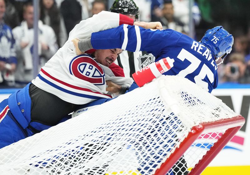 Oct 11, 2023; Toronto, Ontario, CAN; Toronto Maple Leafs right wing Ryan Reaves (75) fights with Montreal Canadiens defenseman Arber Xhekaj (72) during the first period at Scotiabank Arena. Mandatory Credit: Nick Turchiaro-USA TODAY Sports