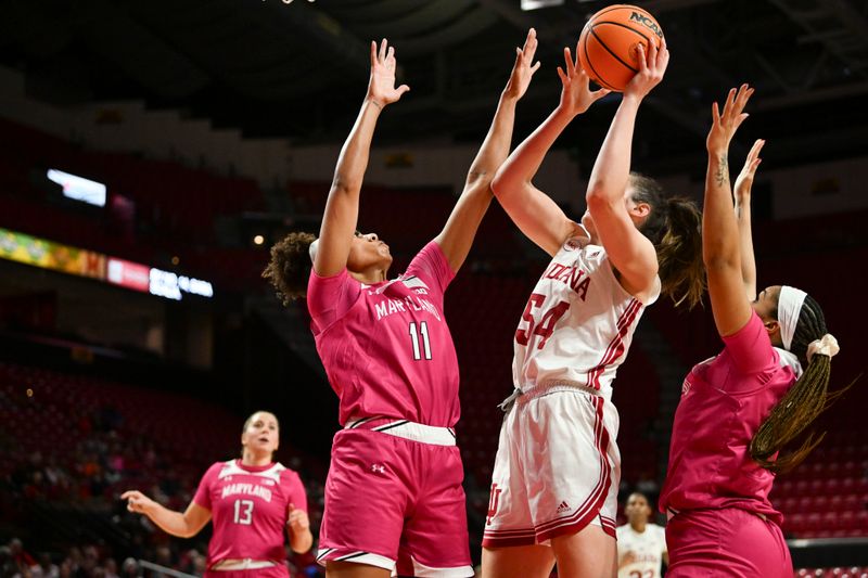 Jan 31, 2024; College Park, Maryland, USA;  Indiana Hoosiers forward Mackenzie Holmes (54) shoots over Maryland Terrapins guard Jakia Brown-Turner (11) during the fist half at Xfinity Center. Mandatory Credit: Tommy Gilligan-USA TODAY Sports