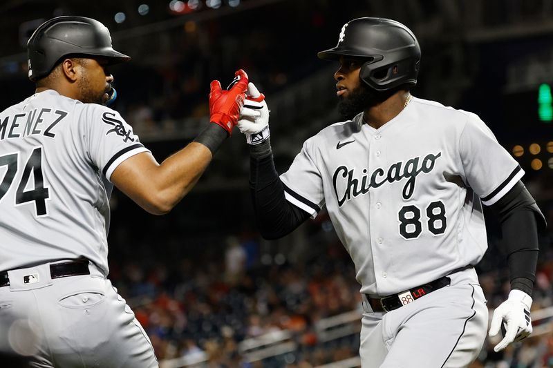 Sep 19, 2023; Washington, District of Columbia, USA; Chicago White Sox center fielder Luis Robert Jr. (88) celebrates with White Sox designated hitter Eloy Jimenez (74) after hitting a home run against the Washington Nationals during the fourth inning at Nationals Park. Mandatory Credit: Geoff Burke-USA TODAY Sports