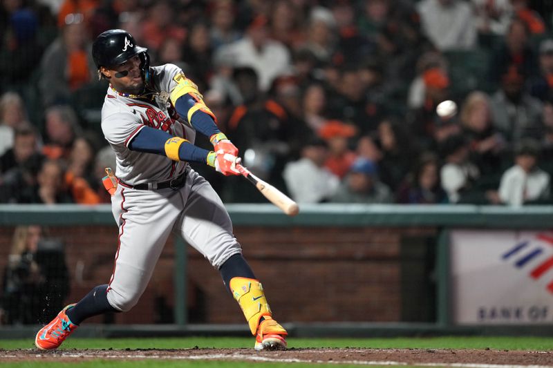 Aug 25, 2023; San Francisco, California, USA; Atlanta Braves right fielder Ronald Acuna Jr. (13) hits a triple against the San Francisco Giants during the sixth inning at Oracle Park. Mandatory Credit: Darren Yamashita-USA TODAY Sports