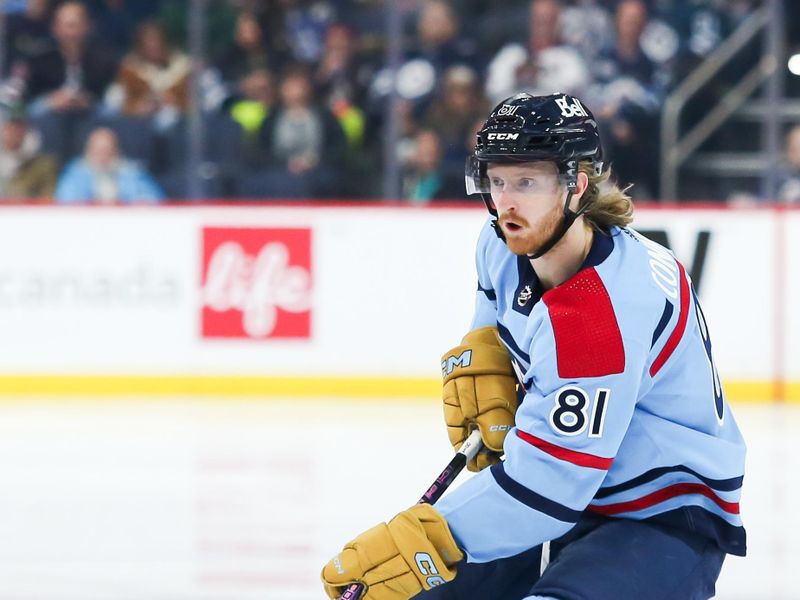 Dec 4, 2023; Winnipeg, Manitoba, CAN;   Winnipeg Jets forward Kyle Connor (81) skates into the Carolina Hurricanes zone during the second period at Canada Life Centre. Mandatory Credit: Terrence Lee-USA TODAY Sports