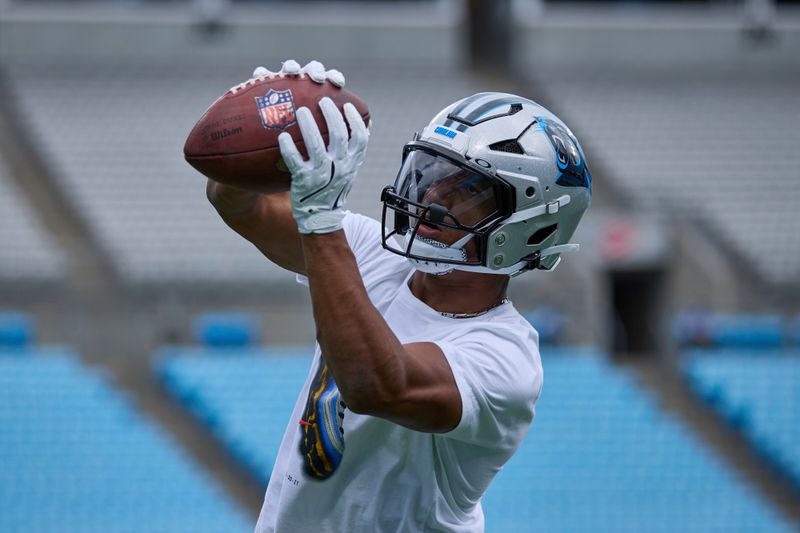 Carolina Panthers running back Chuba Hubbard (30) catches a football prior to an NFL Football game against the Los Angeles Chargers, Sunday, Sep. 15, 2024, in Charlotte, N.C. (AP Photo/Brian Westerholt)