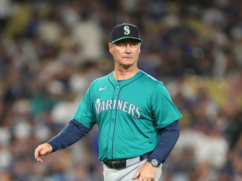 Aug 21, 2024; Los Angeles, California, USA; Seattle Mariners manager Scott Servais reacts during the game against the Los Angeles Dodgers at Dodger Stadium. Mandatory Credit: Kirby Lee-USA TODAY Sports