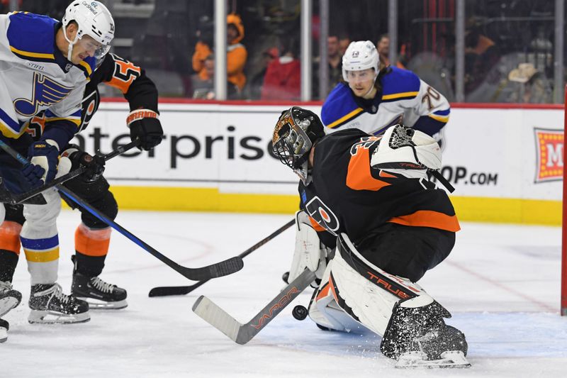 Oct 31, 2024; Philadelphia, Pennsylvania, USA; Philadelphia Flyers goaltender Samuel Ersson (33) makes a save aSt. Louis Blues during the second period at Wells Fargo Center. Mandatory Credit: Eric Hartline-Imagn Images