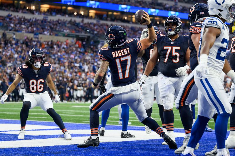 Chicago Bears quarterback Tyson Bagent (17) celebrates a touchdown during an NFL football game against the Indianapolis Colts, Saturday, Aug. 19, 2023, in Indianapolis. (AP Photo/Zach Bolinger)