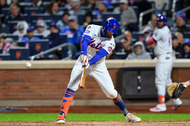 Oct 17, 2024; New York City, New York, USA; New York Mets outfielder Brandon Nimmo (9) hits a single in the sixth inning during game four of the NLCS for the 2024 MLB playoffs at Citi Field. Mandatory Credit: John Jones-Imagn Images