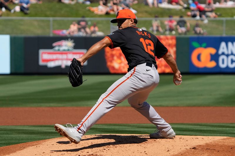 Mar 20, 2024; Tempe, Arizona, USA; San Francisco Giants starting pitcher Jordan Hicks (12) throws a pitch against the Los Angeles Angels in the first inning at Tempe Diablo Stadium. Mandatory Credit: Rick Scuteri-USA TODAY Sports