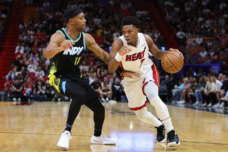 MIAMI, FLORIDA - DECEMBER 02: Kyle Lowry #7 of the Miami Heat drives against Bruce Brown #11 of the Indiana Pacers during the first quarter of the game at Kaseya Center on December 02, 2023 in Miami, Florida. NOTE TO USER: User expressly acknowledges and agrees that, by downloading and or using this photograph, User is consenting to the terms and conditions of the Getty Images License Agreement. (Photo by Megan Briggs/Getty Images)