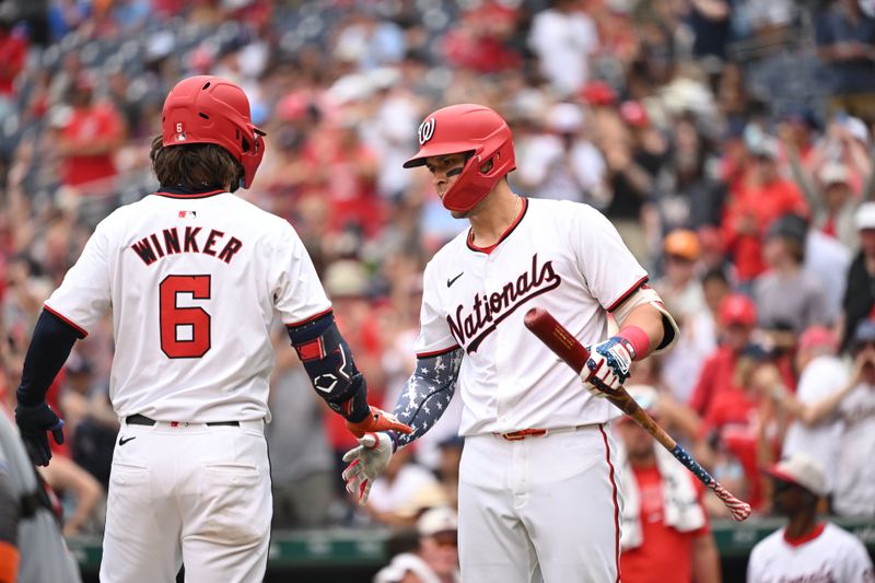 Jul 4, 2024; Washington, District of Columbia, USA; Washington Nationals left fielder Jesse Winker (6) celebrates with first baseman Joey Meneses (45) after hitting a home run against the New York Mets during the eighth inning at Nationals Park. Mandatory Credit: Rafael Suanes-USA TODAY Sports