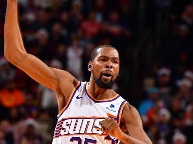 PHOENIX, AZ - DECEMBER 25: Kevin Durant #35 of the Phoenix Suns celebrates during the game against the Dallas Mavericks on December 25, 2023 at Footprint Center in Phoenix, Arizona. NOTE TO USER: User expressly acknowledges and agrees that, by downloading and or using this photograph, user is consenting to the terms and conditions of the Getty Images License Agreement. Mandatory Copyright Notice: Copyright 2023 NBAE (Photo by Barry Gossage/NBAE via Getty Images)