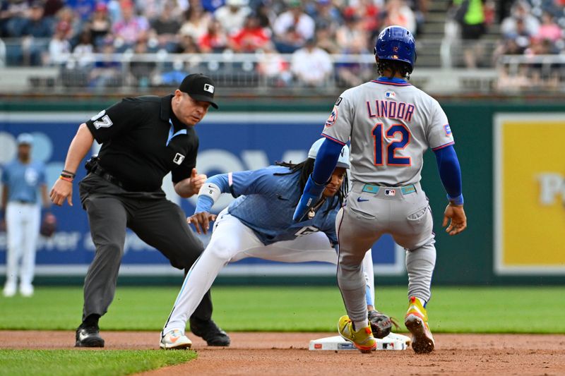 Apr 26, 2025; Washington, District of Columbia, USA; New York Mets shortstop Francisco Lindor (12) is tagged out by Washington Nationals shortstop CJ Abrams (5) attempting to steal second base during the first inning at Nationals Park. Mandatory Credit: Brad Mills-Imagn Images
