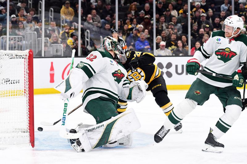 Mar 28, 2026; Boston, Massachusetts, USA; Boston Bruins center Elias Lindholm (28) scores a goal past Minnesota Wild goaltender Filip Gustavsson (32) during the third period at TD Garden. Mandatory Credit: Bob DeChiara-Imagn Images