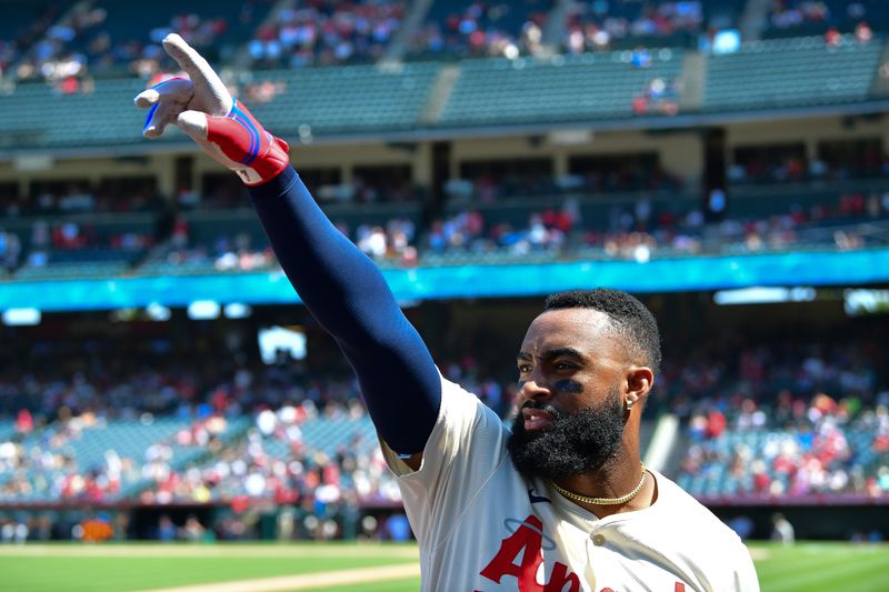 Jul 14, 2024; Anaheim, California, USA; Los Angeles Angels right fielder Jo Adell (7) celebrates after hitting a three run home run against the Seattle Mariners during the eighth inning at Angel Stadium. Mandatory Credit: Gary A. Vasquez-USA TODAY Sports