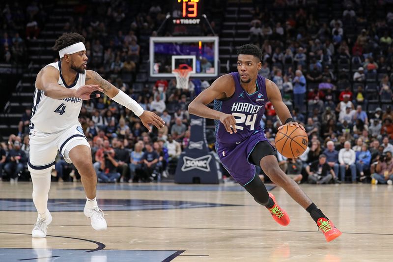 MEMPHIS, TENNESSEE - MARCH 13: Brandon Miller #24 of the Charlotte Hornets drives to the basket against Jordan Goodwin #4 of the Memphis Grizzlies during the second half at FedExForum on March 13, 2024 in Memphis, Tennessee. NOTE TO USER: User expressly acknowledges and agrees that, by downloading and or using this photograph, User is consenting to the terms and conditions of the Getty Images License Agreement. (Photo by Justin Ford/Getty Images)