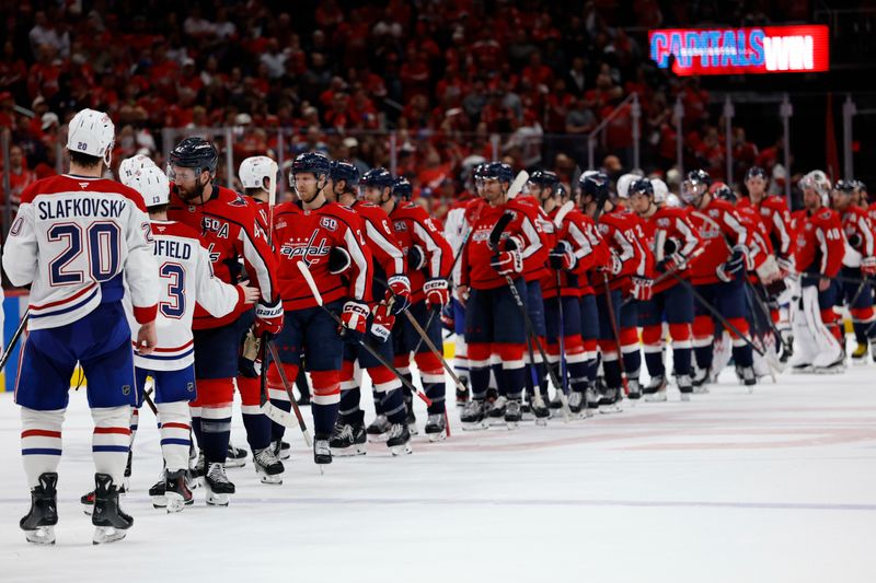 Apr 30, 2025; Washington, District of Columbia, USA; Washington Capitals and Montreal Canadiens players shake hands in the handshake line after game five of the first round of the 2025 Stanley Cup Playoffs at Capital One Arena. Mandatory Credit: Geoff Burke-Imagn Images
