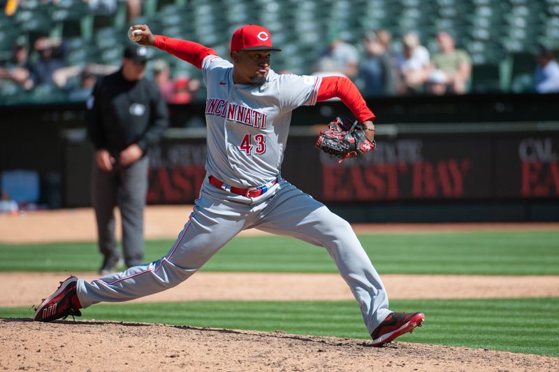 Apr 29, 2023; Oakland, California, USA; Cincinnati Reds relief pitcher Alexis Diaz (43) throws a pitch during the ninth inning against the Oakland Athletics at RingCentral Coliseum. Mandatory Credit: Ed Szczepanski-USA TODAY Sports