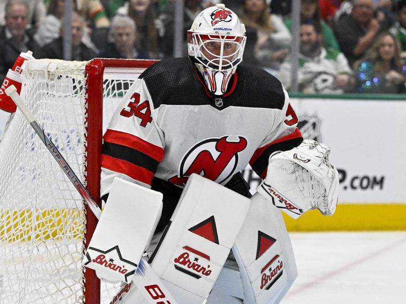 Mar 14, 2024; Dallas, Texas, USA; New Jersey Devils goaltender Jake Allen (34) faces the Dallas Stars attack during the second period at the American Airlines Center. Mandatory Credit: Jerome Miron-USA TODAY Sports