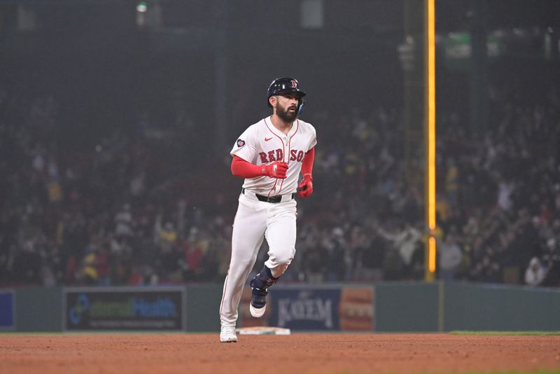 Apr 11, 20024; Boston, Massachusetts, USA; Boston Red Sox catcher Connor Wong (12) hits a home run against the Baltimore Orioles during the eighth inning at Fenway Park. Mandatory Credit: Eric Canha-USA TODAY Sports