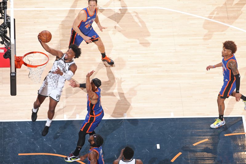 NEW YORK, NY - MARCH 23: Dennis Smith Jr. #4 of the Brooklyn Nets drives to the basket during the game against the New York Knicks on March 23, 2024 at Madison Square Garden in New York City, New York.  NOTE TO USER: User expressly acknowledges and agrees that, by downloading and or using this photograph, User is consenting to the terms and conditions of the Getty Images License Agreement. Mandatory Copyright Notice: Copyright 2024 NBAE  (Photo by Nathaniel S. Butler/NBAE via Getty Images)