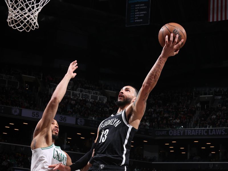 BROOKLYN, NY - MARCH 15: Tyrese Martin #13 of the Brooklyn Nets drives to the basket during the game against the Boston Celtics on March 15, 2025 at Barclays Center in Brooklyn, New York. NOTE TO USER: User expressly acknowledges and agrees that, by downloading and or using this Photograph, user is consenting to the terms and conditions of the Getty Images License Agreement. Mandatory Copyright Notice: Copyright 2025 NBAE (Photo by Nathaniel S. Butler/NBAE via Getty Images)