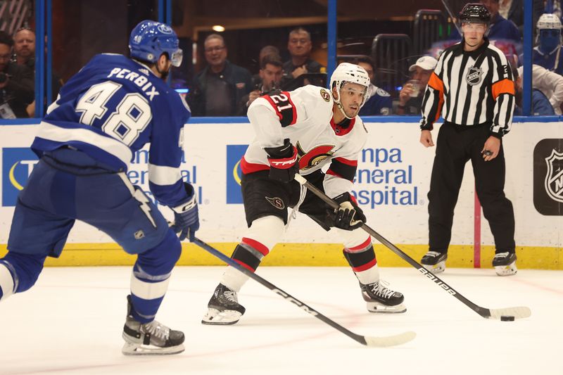 Apr 11, 2024; Tampa, Florida, USA; Ottawa Senators right wing Mathieu Joseph (21) skates with the puck as Tampa Bay Lightning defenseman Nick Perbix (48) defends during overtime at Amalie Arena. Mandatory Credit: Kim Klement Neitzel-USA TODAY Sports