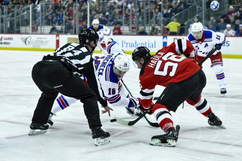 Feb 22, 2024; Newark, New Jersey, USA; New York Rangers center Vincent Trocheck (16) faces off against New Jersey Devils left wing Erik Haula (56) during the first period at Prudential Center. Mandatory Credit: John Jones-USA TODAY Sports